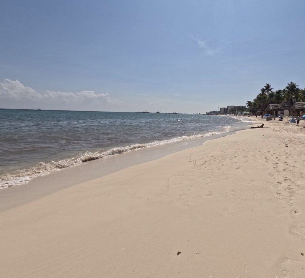 Calm water and clean sand at Playa Mahekal, at the end of Calle 38