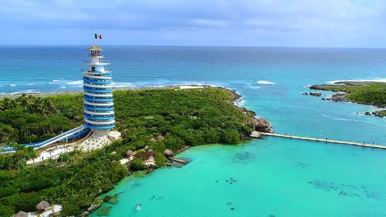 The spiral viewing tower and turquoise inlet of Xel-Há park